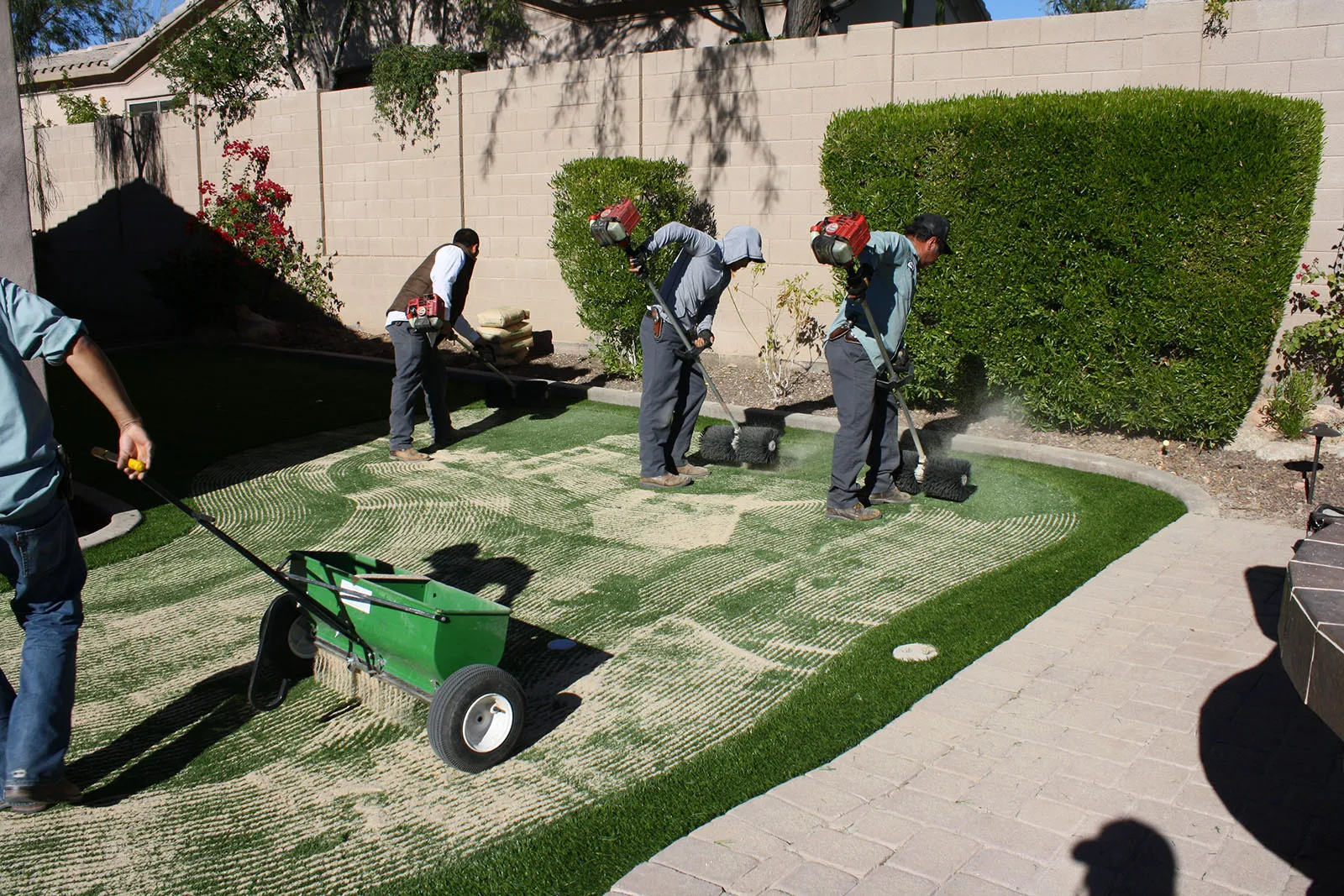 Applying the sand.